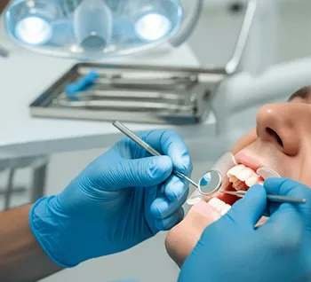 Dentist providing emergency treatment to a patient in our Christchurch clinic.